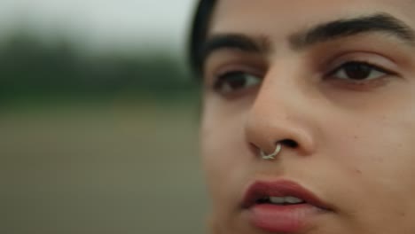 Close-up-of-a-young-man's-face,-evoking-intensity-and-focus,-overcast-day