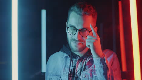 stylish man in neon lighting