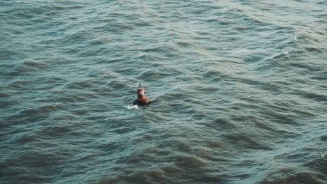 slow motion shot of a buoy a floating in the indian ocean.
