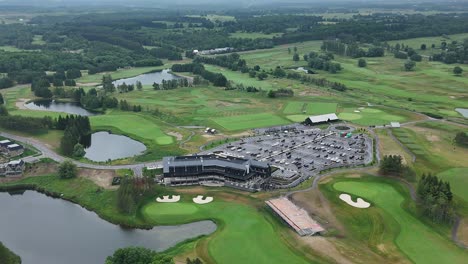 aerial: tpc toronto at osprey valley golf course during the day in alton, caledon, ontario, canada, orbit drone shot