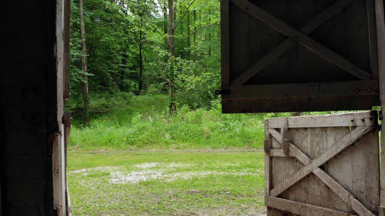 Old White Horse Barn Doors Pulling Away Shot