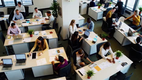 high-angle view of a modern open-plan office with collaborating professionals