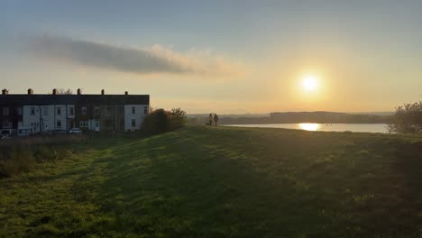 two people out walking with a dog