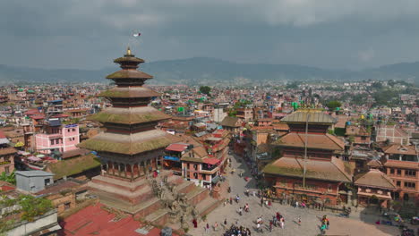 bhaktapur durbar square unesco world heritage site, nyatapole temple pagoda style nepal, landscape, urbanization, hills, valley, greenery, touristic place, cool weather, festive place drone shot 4k