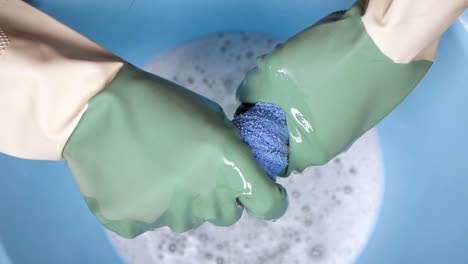 washing cloth with rubber gloves