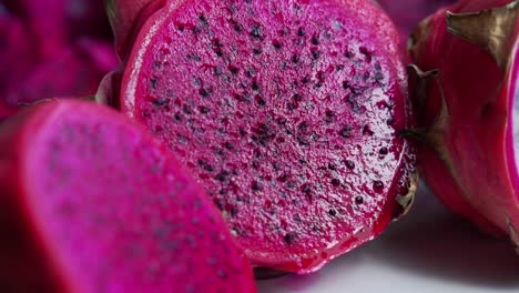 Fruit-cut-in-half-Close-up-of-Red-and-white-dragonfruit-Red-Dragon-Fruit-Slices-and-Cultivating-Exotic-Plants-pitaya