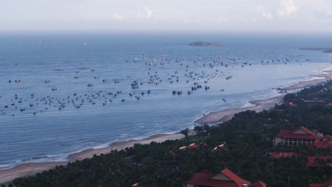 many fisherman boats moored on coastline of mui ne of thai hon lao island