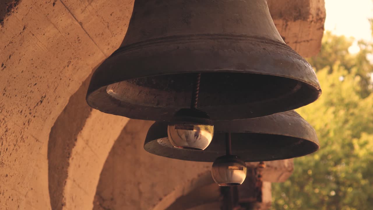 A lonely bell, struck by a man