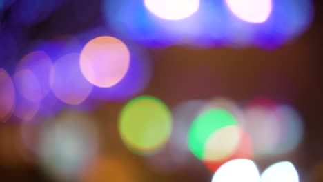 bokeh colorful circles of festive lights on black background