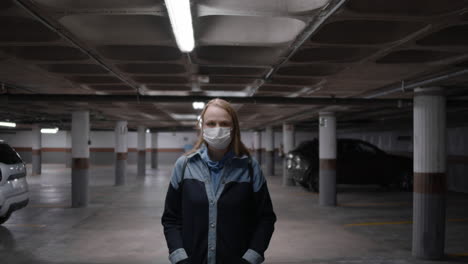 woman in mask in underground garage