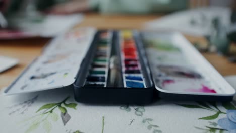 watercolor paint palette on a table