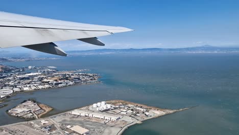 airplane passenger pov of south san francisco, california usa after taking off from international airport