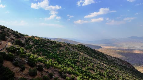 Beautiful-landscape-view-while-riding-a-chairlift-descending-Korek-Mountain-with-Rawanduz-city,-Kurdistan-Iraq-in-the-valley