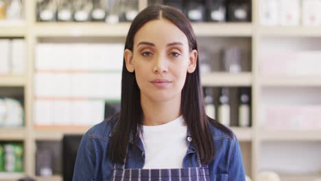 animation of happy biracial waitress standing in coffee shop