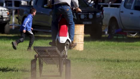 rider jumps over ramps in motocross competition