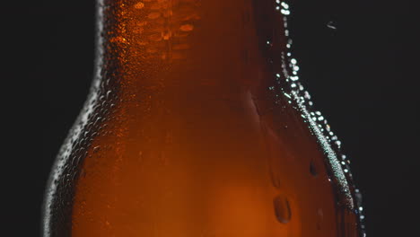 Close-Up-Of-Condensation-Droplets-Running-Down-Bottle-Of-Cold-Beer-Or-Soft-Drink