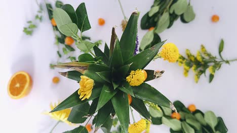 pineapple flower arrangement with oranges