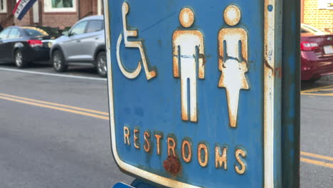 a closeup view of a public restroom sign on a street corner in chatham cape cod massachusetts usa