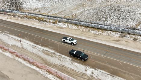 aerial tracking of traffic along a coastal road in winter