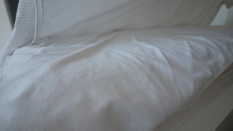 white bed sheets and mattress