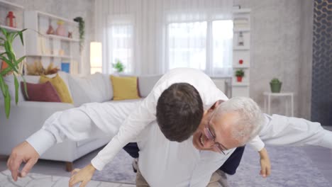 father and son are having fun at home, playing games.