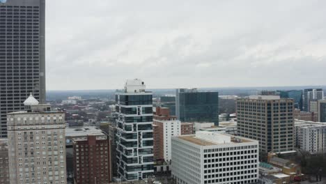 drone shot above midtown atlanta on a cloudy day after a storm