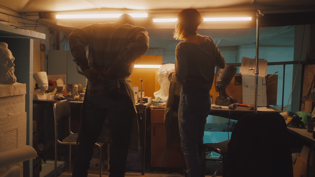 Artists Working in a Sculpture Studio with Classical Busts