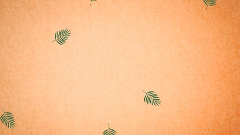 animation of green leaves on orange background