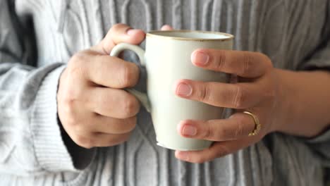 woman holding a mug