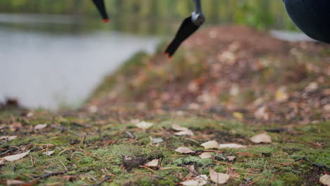 Unfolded-DJI-Air-3-placed-on-the-ground-in-the-nature-by-a-caucasian-man