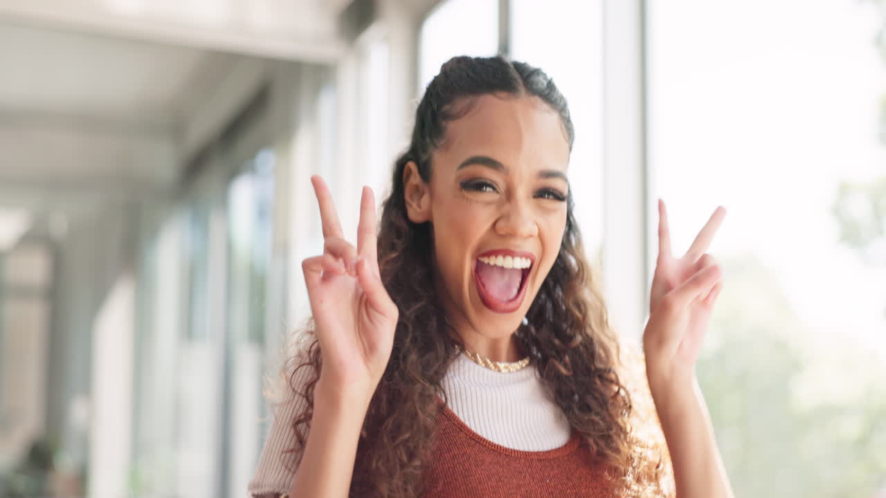 Success, face and creative woman with a peace sign