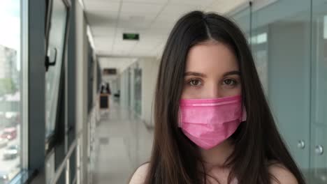 young girl in hospital in a mask