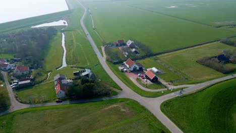 Flying-over-the-small-village-near-the-lake-in-Netherlands