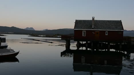 an island in norway when the sun is setting