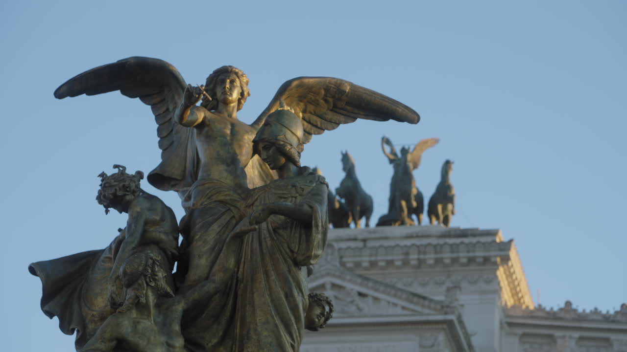 Victor Emmanuel II Monument, focus shift between the 'Thought' statue on the foreground and the 'Quadriga dell' Unità' on the background