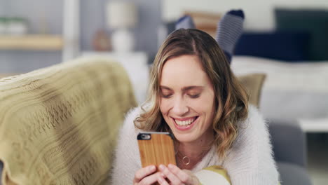 Happy,-smile-or-woman-with-phone-on-sofa