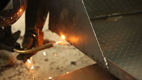 welder attaching melting sheets together