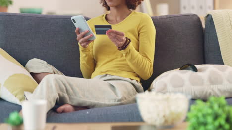 woman cheering while shopping online for bargains