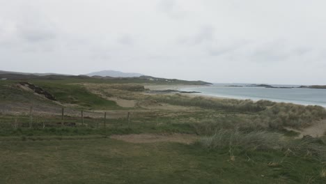 beach on the atlantic ocean in ireland with mountains