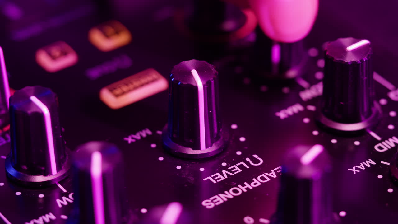 DJ with headphones and sunglasses playing music on festival in night club. Techno musician performing at nightclub for concert crowd of people, city bar.