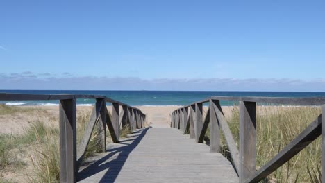 tracking shot on walkway to the beach