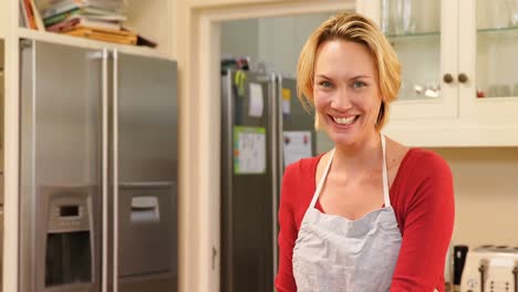 smiling woman wearing apron spreading dough in baking tin 4k 4k