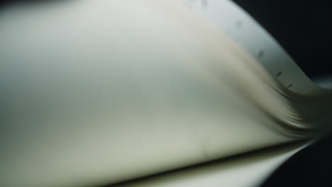 close-up of book pages curling