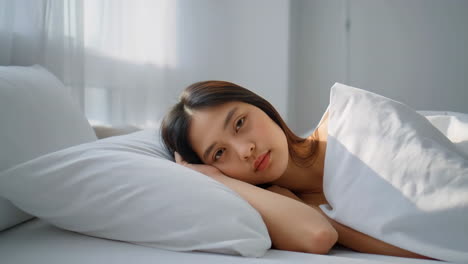 woman sleeping peacefully in bed