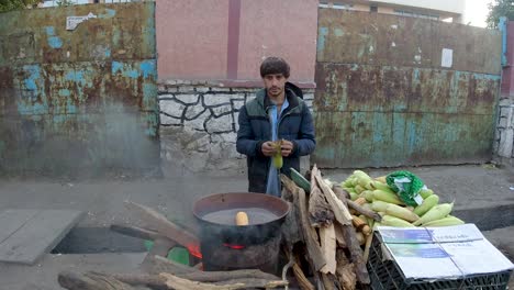 roasting corn in sand