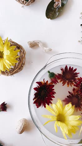 autumn floral arrangement in a glass bowl