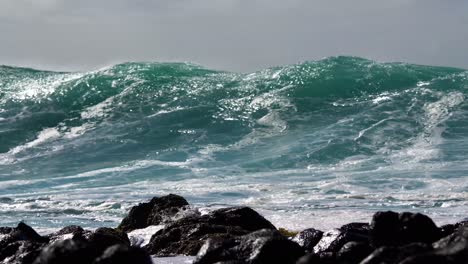 blue waves roll into the coast of hawaii in slow motion 1