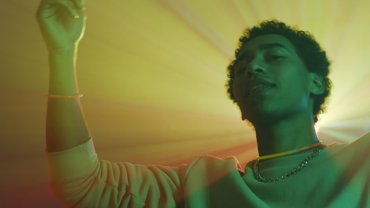 Happy guy dancing with his friends