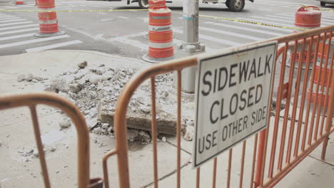 slow motion rack focus close up of a sidewalk closed sign and work site in nyc