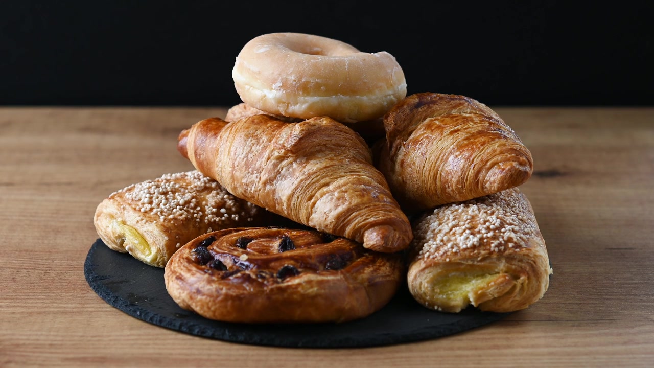 Hand picking sweet pastries